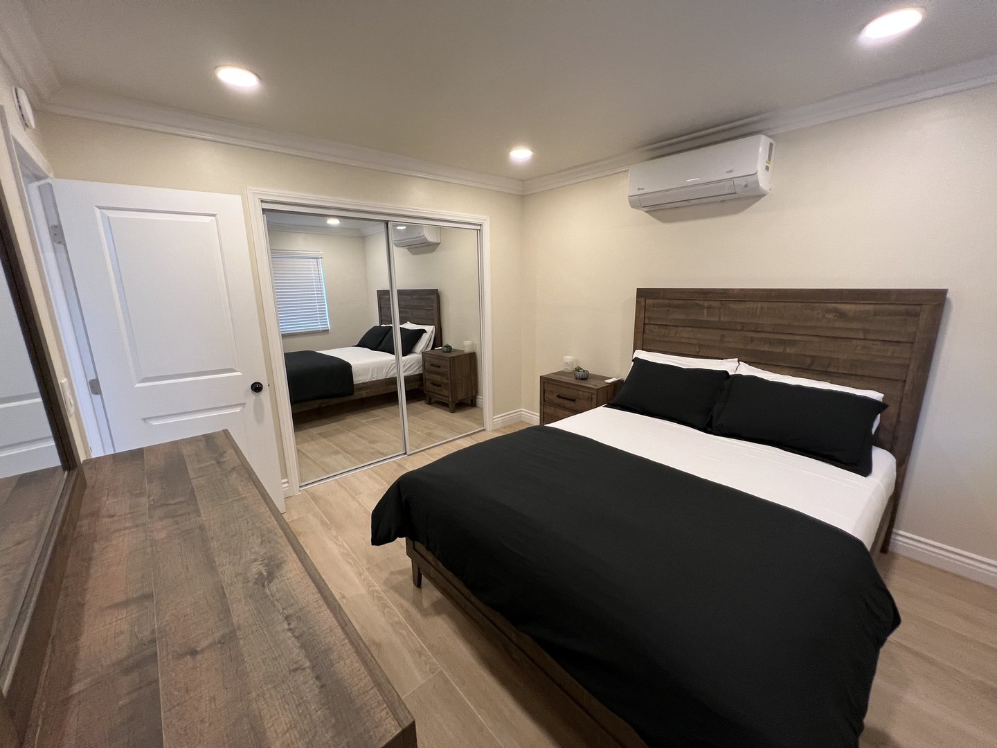 Bedroom with full bed and desk space for study or work at Her Aria women's recovery residence