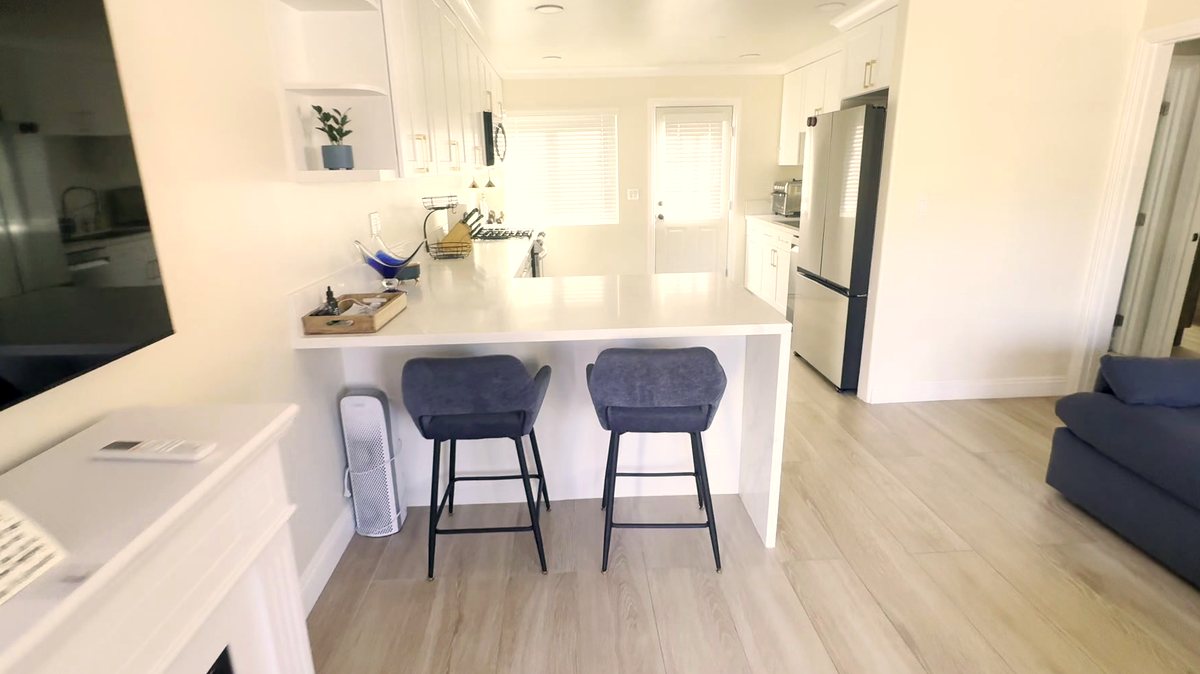 Kitchen island with bar seating in a women's recovery residence in Montclair, California