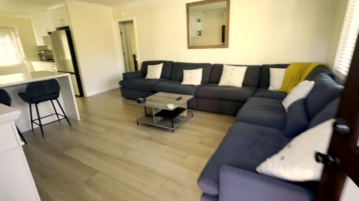 Open floor plan in a women's recovery residence in Montclair, California — living room and kitchen